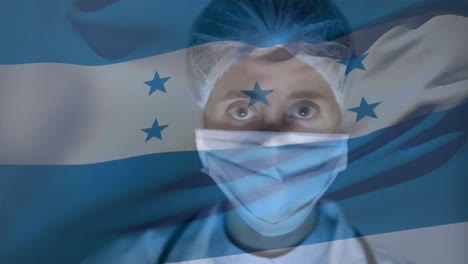 Honduran-flag-waving-against-female-scientist-wearing-face-mask