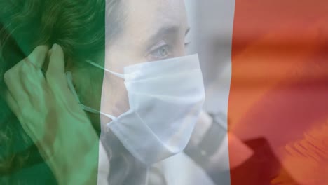 Irish-flag-waving-against-woman-wearing-face-mask