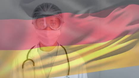 German-flag-waving-against-female-doctor-wearing-protective-clothes