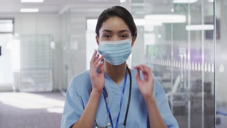 Portrait-of-female-doctor-wearing-face-mask-in-hospital