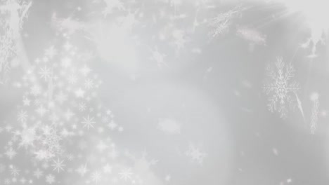 Snowflakes-falling-against-white-background