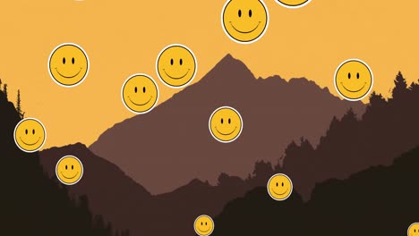 Multiple-smiling-face-emojis-floating-against-landscape-with-mountains