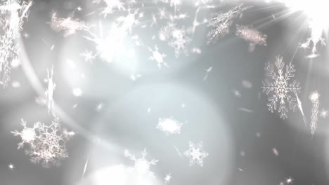 Leuchtende-Lichtpunkte-Vor-Schneeflocken,-Die-Auf-Grauen-Hintergrund-Fallen