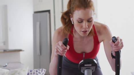Woman-exercising-on-stationary-bike-at-home