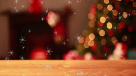 Snowflakes-falling-against-flickering-fairy-lights-on-Christmas-tree