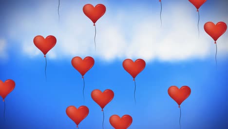 Multiple-heart-shaped-balloons-floating-against-blue-sky