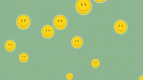 Multiple-smiley-face-emojis-floating-against-green-background