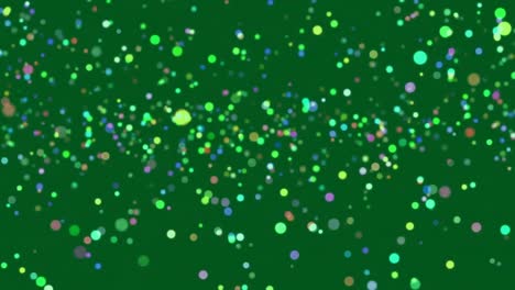 Glowing-spots-of-light-moving-against-green-background