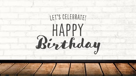 Digital-animation-of-lets-celebrate-happy-birthday-text-on-wooden-surface-against-brick-wall-in-back