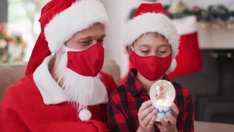 Caucasian-man-wearing-face-mask-dressed-as-santa-claus