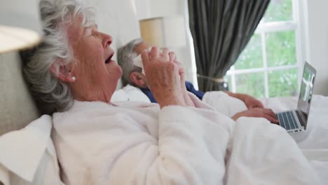 Sick-senior-caucasian-woman-sneezing