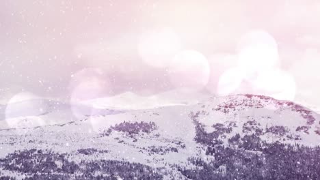 Digital-animation-of-snow-falling-over-winter-landscape-against-spots-of-light