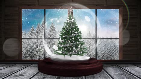 Animation-of-snow-globe-with-christmas-tree-and-winter-scenery-seen-through-window