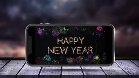 Digitale-Animation-Von-Texten-Zum-Thema-„Frohes-Neues-Jahr“-Und-Explodierenden-Feuerwerkskörpern-Auf-Dem-Smartphone-Bildschirm