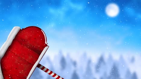 Digital-animation-of-snow-falling-over-santa-hat-on-red-wooden-sign-posts-against-winter-landscape