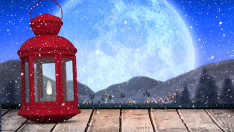 Digital-animation-of-snow-falling-over-christmas-lamp-on-wooden-surface-against-moon-in-night-sky