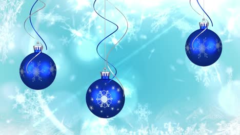 Animation-of-blue-christmas-baubles-decoration-and-snowflakes-falling-on-blue-background