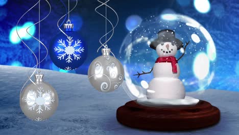 Animation-of-blue-and-silver-christmas-baubles