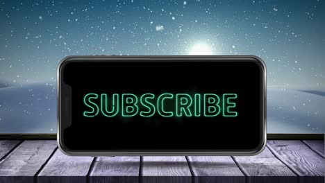 Digital-animation-of-subscribe-neon-text-on-smartphone-screen-on-wooden-surface-against-snow-falling