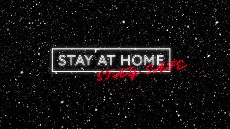 Animation-of-stay-at-home-stay-safe-text-with-winter-scenery-and-snow-falling-on-black-background
