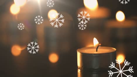 Animation-of-lit-candle-and-falling-multiple-white-snowflakes