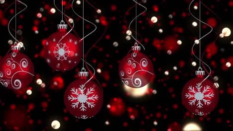 Animation-of-five-red-baubles-christmas-decoration-with-flickering-fairy-lights-on-black-background