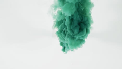 Green-cloud-of-smoke-moving-on-white-background