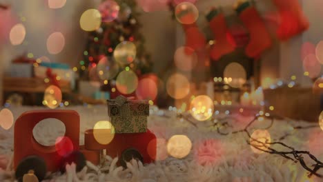 Animation-Von-Weihnachtlich-Flackernden-Lichterketten-über-Holzspielzeug-Im-Wohnzimmer