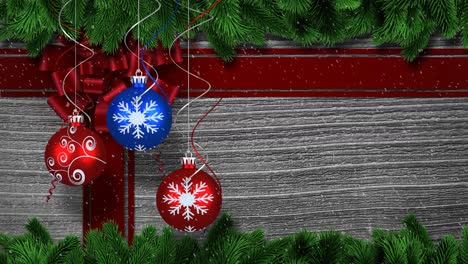 Animation-of-christmas-decorations,-baubles-and-ribbon-with-snow-falling