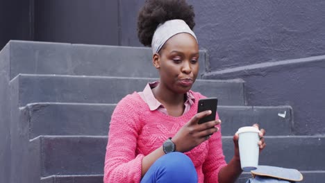 African-american-using-her-smartphone-in-street