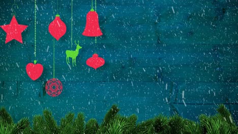 Animation-of-red-christmas-decorations-with-snow-falling-on-blue