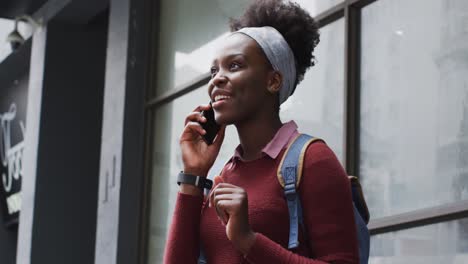African-american-talking-on-her-smartphone-in-street