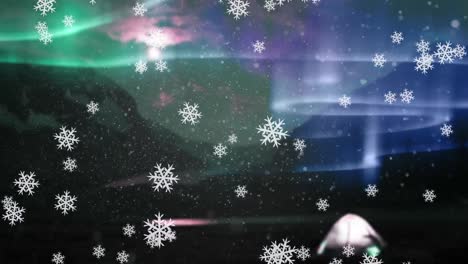 Digital-animation-of-snowflakes-falling-against-colorful-light-trails-in-night-sky