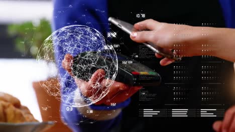 Animation-of-globe-of-network-of-connections-over-woman-paying-with-smartphone-at-terminal