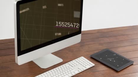 Animation-of-numbers-changing-on-computer-screen-with-tablet-on-desk-on-white-background
