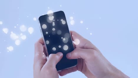 Animation-of-multiple-white-spots-over-woman-using-smartphone-on-blue-background
