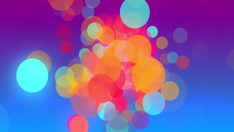 Multicoloured-circles-moving-and-multiplying-to-fill-a-graduated-blue-background