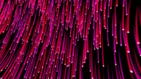 Red-and-pink-fibre-strands-moving-seamlessly-downwards-on-black-background