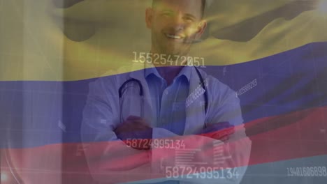 Animation-of-flag-of-colombia-with-statistics-and-smiling-male-doctor