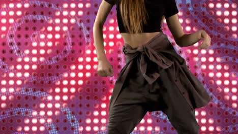 Animation-of-mid-section-of-caucasian-woman-dancing-over-glowing-pink-pattern-background