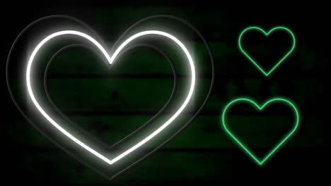 Animation-of-white-and-yellow-and-green-neon-hearts-flashing-on-dark-wooden-background