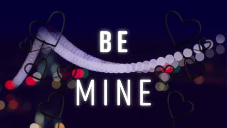Animation-of-words-be-mine-with-red-and-pink-neon-hearts-flashing-on-bokeh-night-city