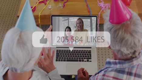 Animation-of-speech-bubble-with-thumbs-up-and-numbers-growing-over-senior-couple-using-laptop-on-vid