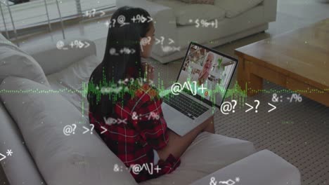 Animation-of-numbers-changing-and-graphic-equalizer-changing-over-woman-using-laptop-on-video-call