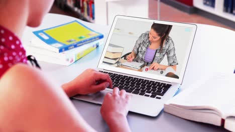 Caucasian-female-teacher-using-laptop-on-video-call-with-female-student