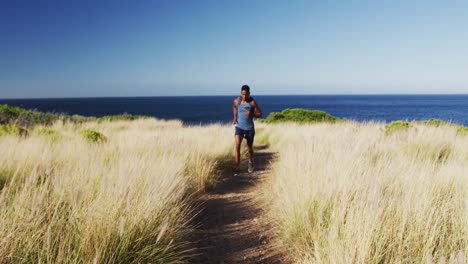 African-american-man-cross-country-running-in-countryside-on-a-coast