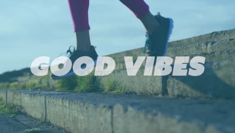 Animation-of-words-good-vibes-over-woman-exercising-on-promenade-by-the-sea