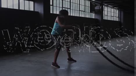 Animation-of-words-level-up-over-man-exercising-with-ropes-in-an-abandoned-building