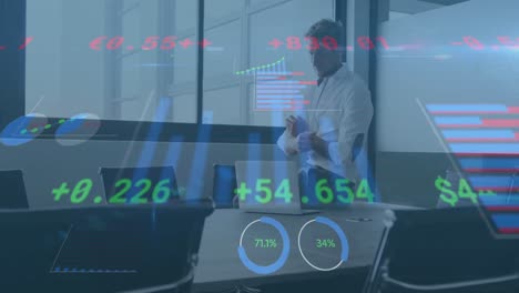 Animation-of-interface-showing-data-and-statistics-with-businessman-working-in-office