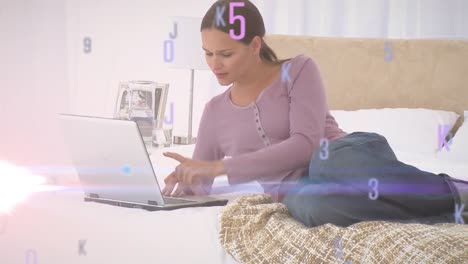 Animation-of-floating-colourful-letters-and-numbers-over-woman-lying-on-bed-using-a-laptop